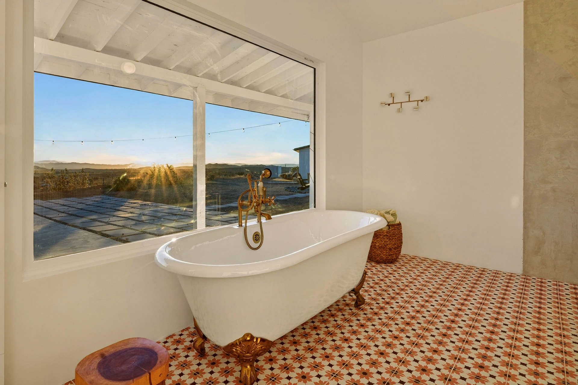 Clawfoot soaking tub facing the sunrise view