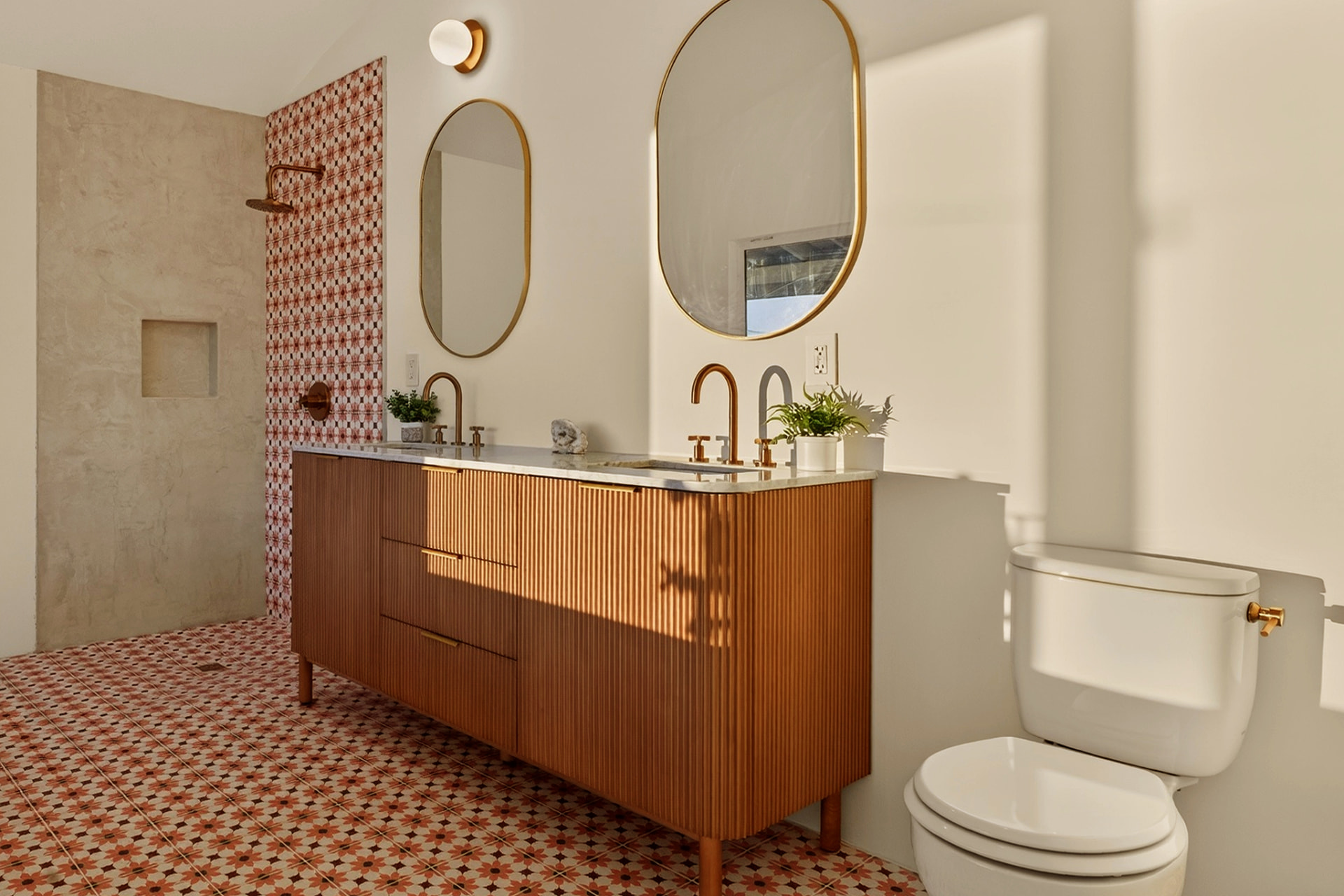 Bathroom with double vanity and patterned tile