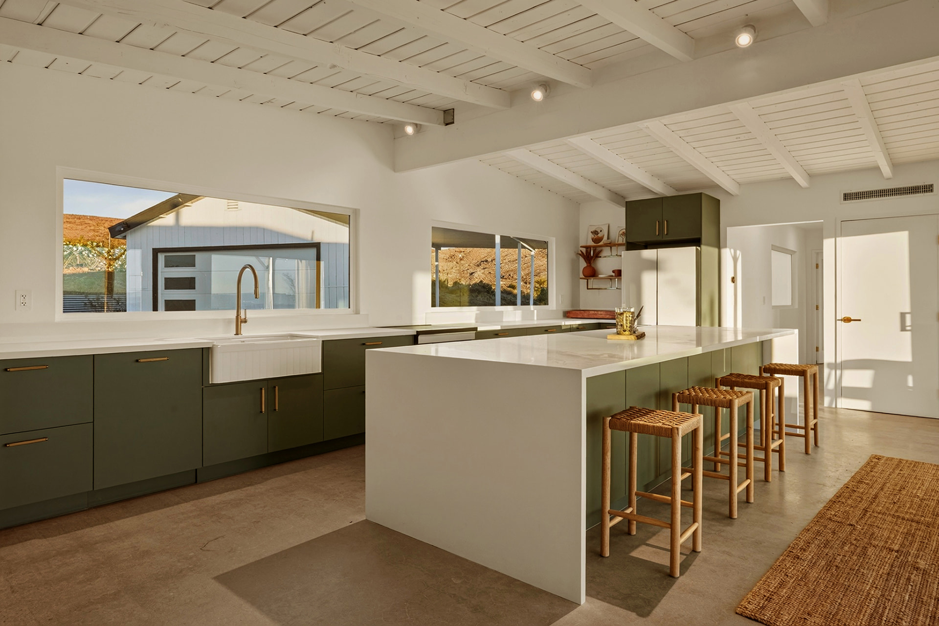Kitchen sink with window over the pool and cabana