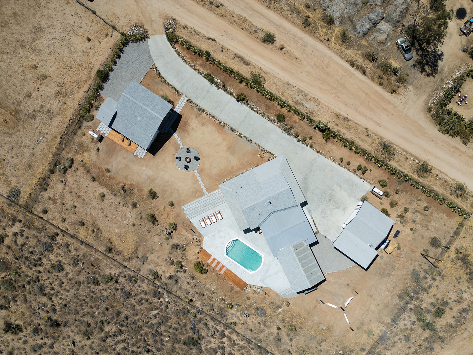 Aerial daytime view of the estate, pool, casita and drive