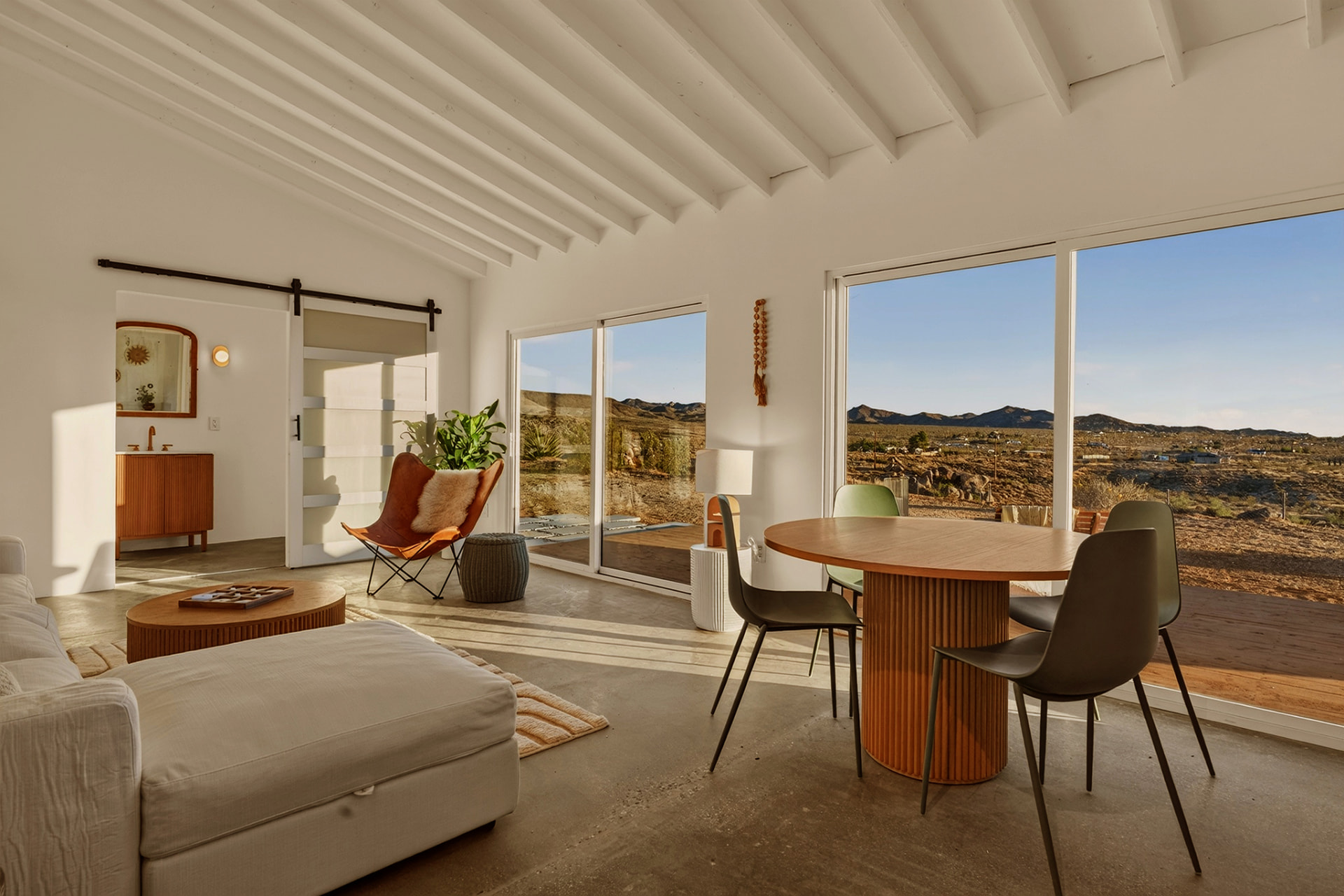 Casita dining table by picture windows overlooking the desert hills